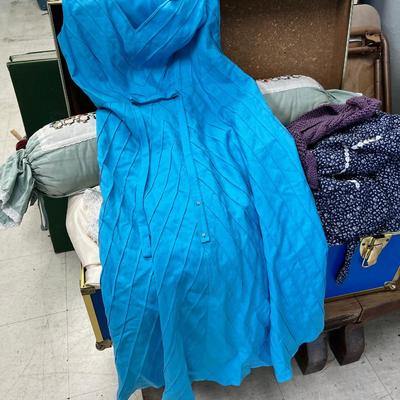 Blue storage locker full of vintage clothes, yardage