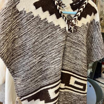 Rack of vintage clothing Crocheted sweater , Silk jackets