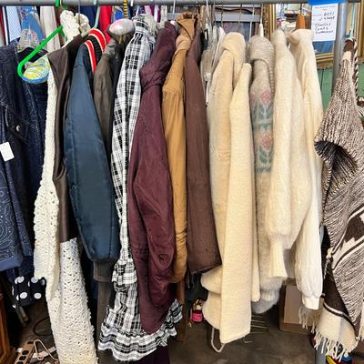 Rack of vintage clothing Crocheted sweater , Silk jackets