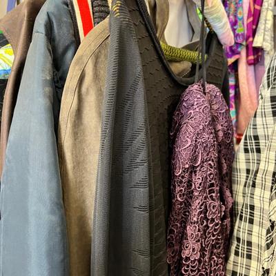 Rack of vintage clothing Crocheted sweater , Silk jackets