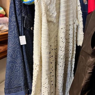 Rack of vintage clothing Crocheted sweater , Silk jackets