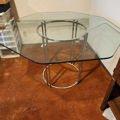 Octagonal glass dining table with chrome base