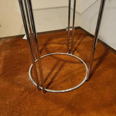 Octagonal glass dining table with chrome base