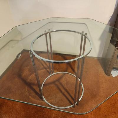 Octagonal glass dining table with chrome base