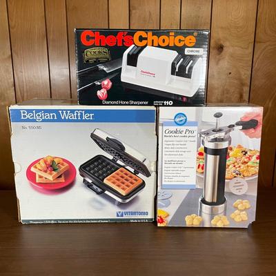LOT 57B: Chefs Choice Diamond Hone Sharpener, Wilton Cookie Press & Vitantonio Belgian Waffle Maker w/ Boxes