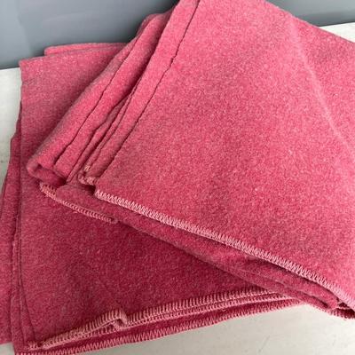 25- Two rose colored wool blankets