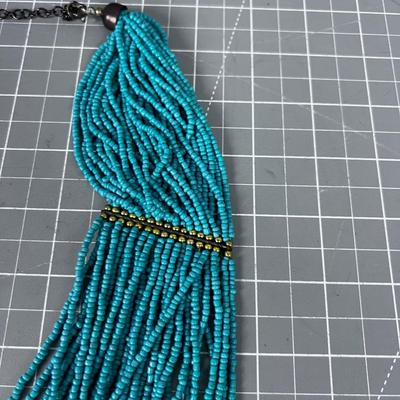 Turquoise Colored Tiny Beads and Lots of Strings