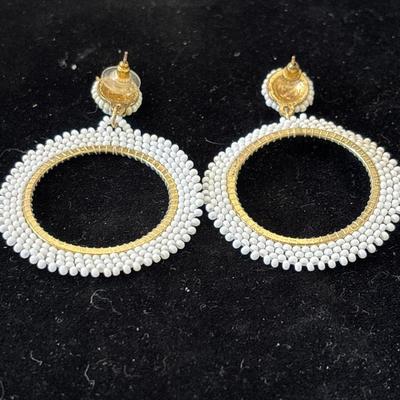 Gold tone white beaded hoop earrings