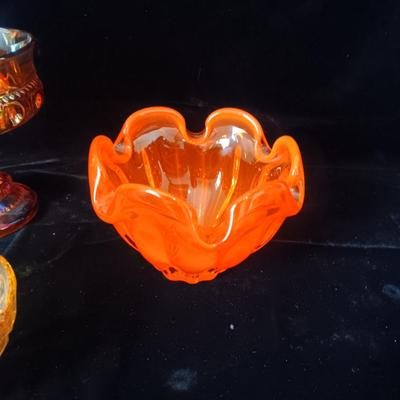 A COLLECTION OF VINTAGE COLORED GLASS PIECES