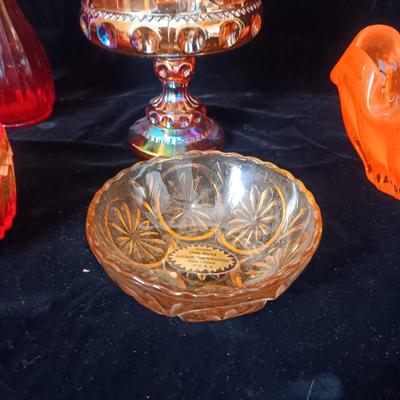 A COLLECTION OF VINTAGE COLORED GLASS PIECES