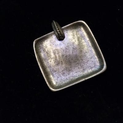 Silver pendant for a necklace