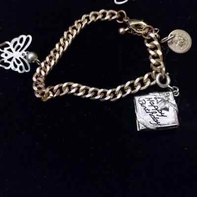 Gold bracelets with charms