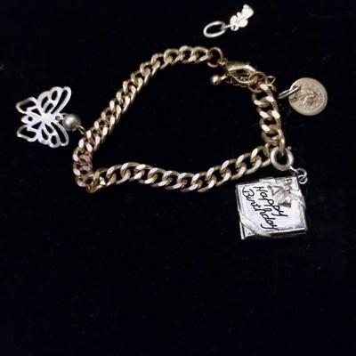 Gold bracelets with charms