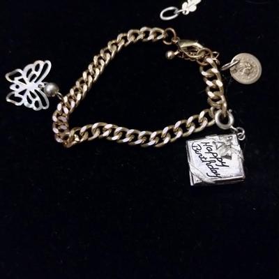 Gold bracelets with charms