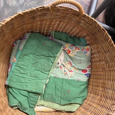 Wooden cabinet baskets full of antique quilts