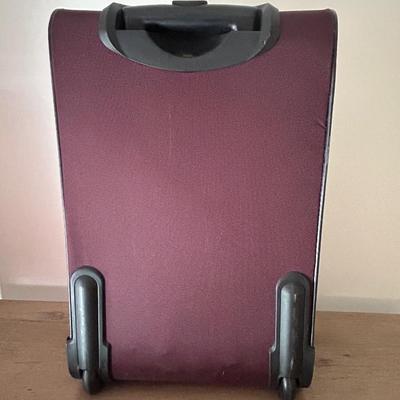 LOT 5: Two Carry On Size Luggage