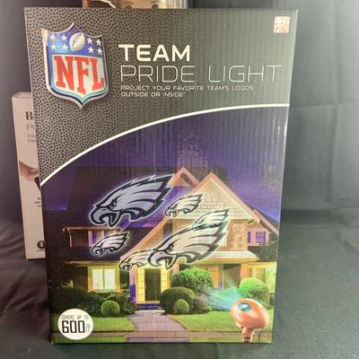 LOT:31: New in Box Football & More Collection Featuring Eagles NFL Team Pride Light, Dan Marino Funko Pop, Brookstone Picture Fan and...