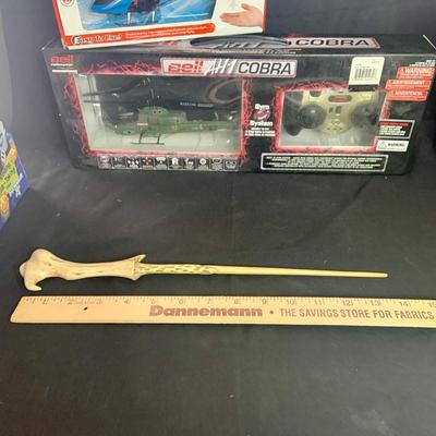 LOT:32: Toy & Games New in Original Packaging Harry Potter Figure and Trivia Game, Boggle, Farkle, and 2 Different Toy Helicopters