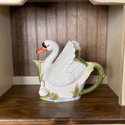 LOT 83: Farmhouse Cabinet with Decorative Swan and Pheasant Pitchers