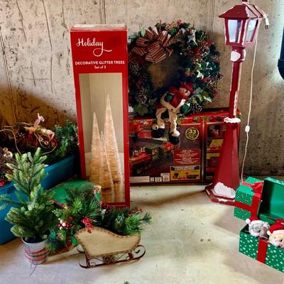LOT:150: Indoor and Outdoor Holiday Decor with North Pole Express Train and Set of 3 Holiday Decorative Glitter Trees in Original Boxes,...