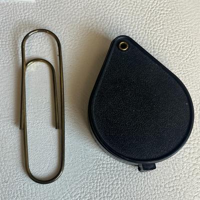 New Flashlight, Large Metal Paperclip and Handheld Magnifying Glass