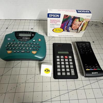 Miscellaneous Calculator, Remote and Glossy Printer Paper and Label Maker