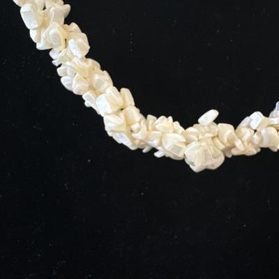 Vintage ivory chipped, puka shell three strand twist necklace