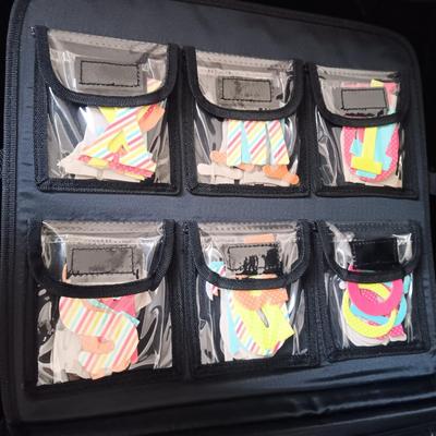 A LARGE SELECTION OF SCRAPBOOKING EMBELLISHMENTS AND PAPER
