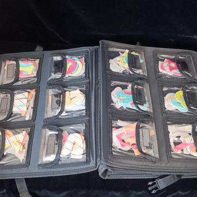 A LARGE SELECTION OF SCRAPBOOKING EMBELLISHMENTS AND PAPER