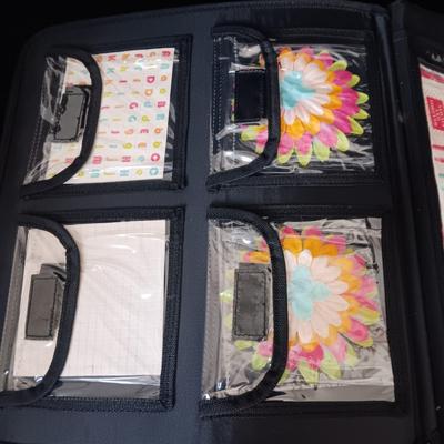 A LARGE SELECTION OF SCRAPBOOKING EMBELLISHMENTS AND PAPER