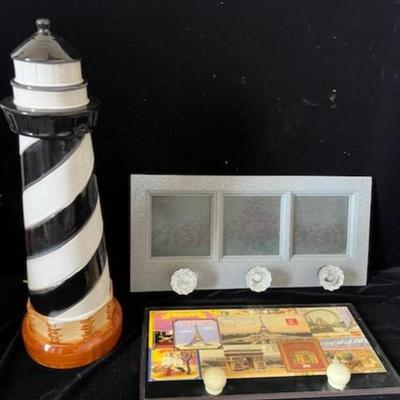 2 WALL HUNG COAT RACKS AND A CERAMIC LIGHTHOUSE