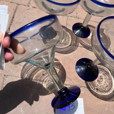 Set a four blue rimmed margarita glasses