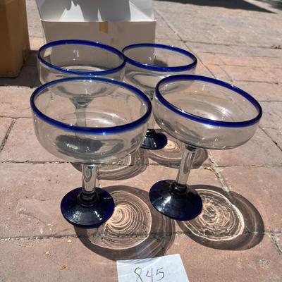 Set a four blue rimmed margarita glasses