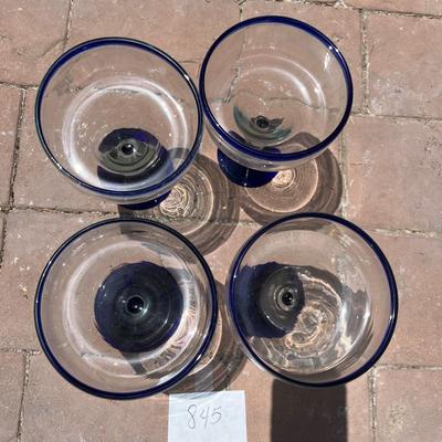 Set a four blue rimmed margarita glasses