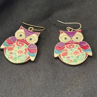 Gold tone owl earrings with floral middle