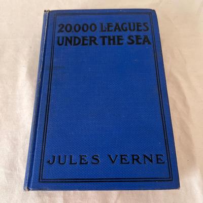 Antique Books Including A Christmas Carol, Brave Men, and 20,000 Leagues Under The Sea (UB-DZ)