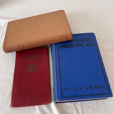 Antique Books Including A Christmas Carol, Brave Men, and 20,000 Leagues Under The Sea (UB-DZ)