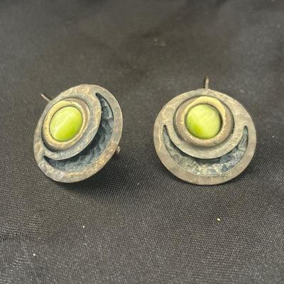 Vintage round earrings with green gem in middle