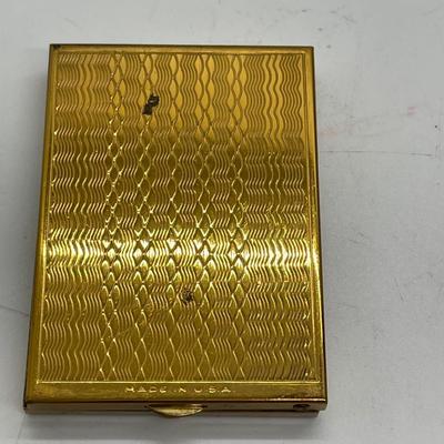 Gold tone pocket sized photo album