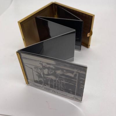 Gold tone pocket sized photo album