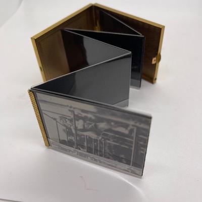 Gold tone pocket sized photo album