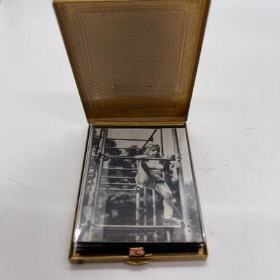 Gold tone pocket sized photo album