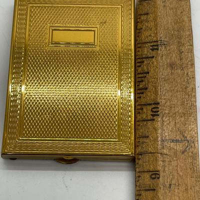 Gold tone pocket sized photo album