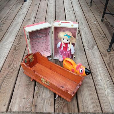 WIND UP MUSICAL DOLL, CARRY CASE, WOODEN DOLL CRADLE AND DOG FLASHLIGHT