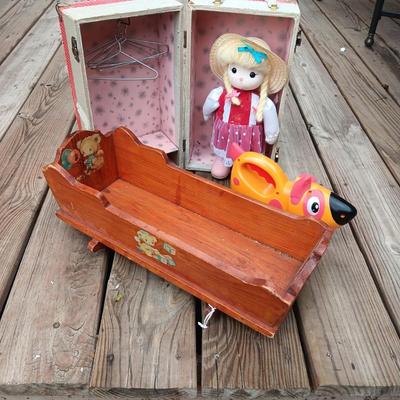 WIND UP MUSICAL DOLL, CARRY CASE, WOODEN DOLL CRADLE AND DOG FLASHLIGHT