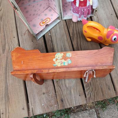 WIND UP MUSICAL DOLL, CARRY CASE, WOODEN DOLL CRADLE AND DOG FLASHLIGHT