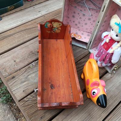 WIND UP MUSICAL DOLL, CARRY CASE, WOODEN DOLL CRADLE AND DOG FLASHLIGHT