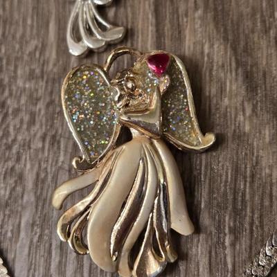 Miriam Haskell Angel Bracelet, an Angel Brooch, and Silver Tone Necklace