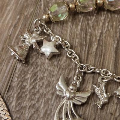 Miriam Haskell Angel Bracelet, an Angel Brooch, and Silver Tone Necklace
