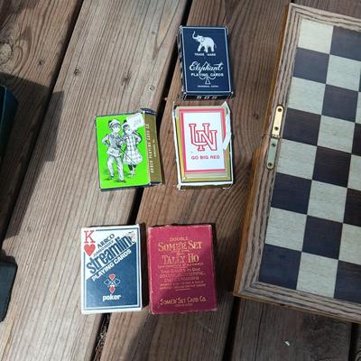 WOODEN CHESS BOARD AND SEVERAL DECKS OF CARDS